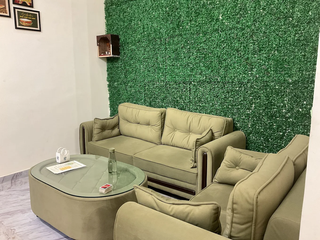 KAAFII Café Newai cozy sofa seating with green moss wall